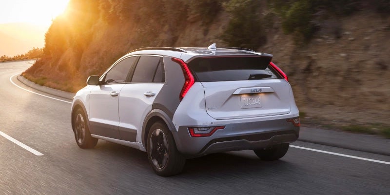 A 2024 Kia Niro driving into the sunset near New Port Richey, FL 