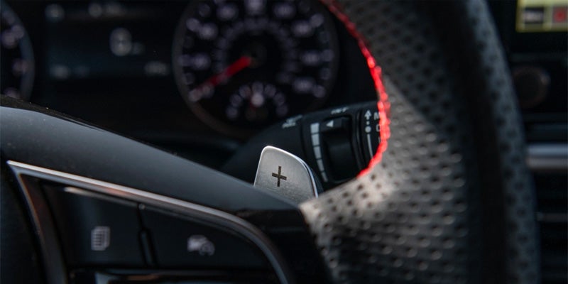 The steering wheel details on the 2024 Kia Forte in New Port RIchey, FL