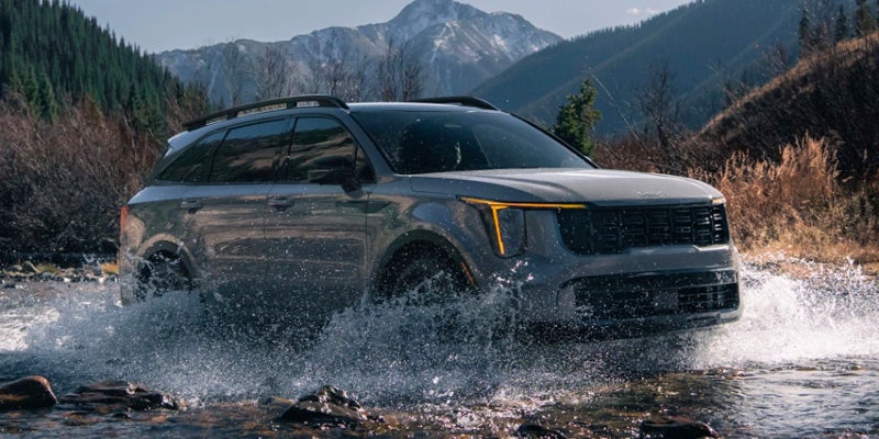 A 2024 Kia Sorento using its powerful engine to ford a river in New Port Richey, FL