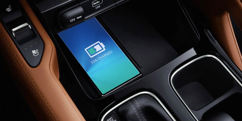 A phone charging in a 2024 Kia Telluride in New Port Richey, FL